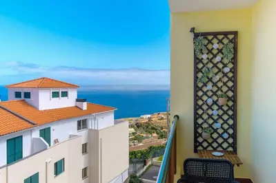 a balcony with a view of the ocean at GuestReady - Idyllic vacation with stunning views in Caniço