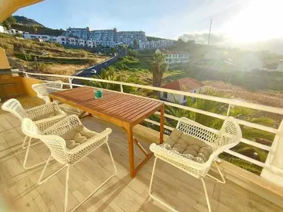 a table and chairs on a balcony with a view at Ocean View Terrace by GALMI in Santa Cruz