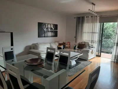 a bedroom with a bed with black and white pillows at Charm Residence Apartment - Free Park in Funchal