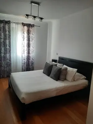 a dresser in a room with a painting on the wall at Charm Residence Apartment - Free Park in Funchal