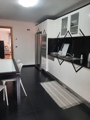 a bedroom with a large bed with white sheets and pillows at Charm Residence Apartment - Free Park in Funchal