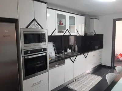 a bathroom with a white sink and a bath tub at Charm Residence Apartment - Free Park in Funchal