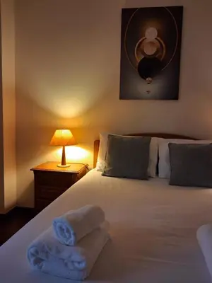 a bedroom with a bed with towels on it at Ribeira Brava Studios - G in Ribeira Brava