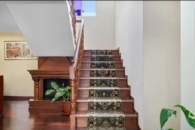 a spiral staircase with a plant in the middle at Ribeira Brava Studios - J in Ribeira Brava