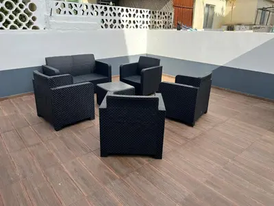 a group of chairs and tables in a lobby at Stylish 3-bedroom flat in Funchal in Funchal