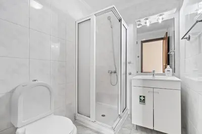 a bathroom with a shower and a toilet and a sink at Ribeira Brava Studios - P in Ribeira Brava