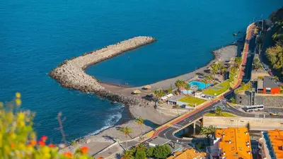 an aerial view of a beach next to the water at Ribeira Brava Studios - P in Ribeira Brava