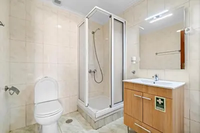 a bathroom with a shower and a toilet and a sink at Ribeira Brava Studios - H in Ribeira Brava