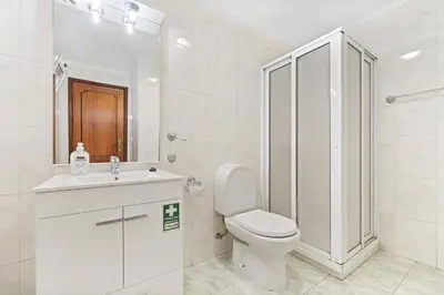 a bathroom with a toilet and a sink and a shower at Ribeira Brava Studios - L in Ribeira Brava