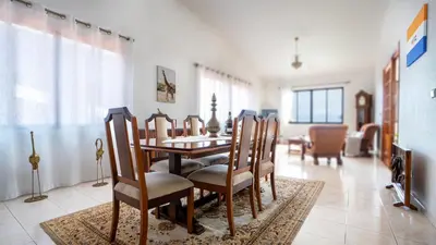a dining room with a table and chairs at Ideia Cottage - Sea View in Ribeira Brava