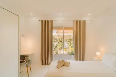 a bedroom with a bed and a window at Family & Friends in Sagres