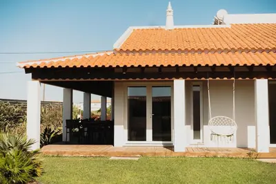 a white house with an orange tile roof at Family & Friends in Sagres