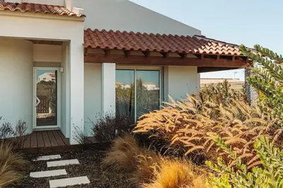 a house with a porch and some plants at Family & Friends in Sagres