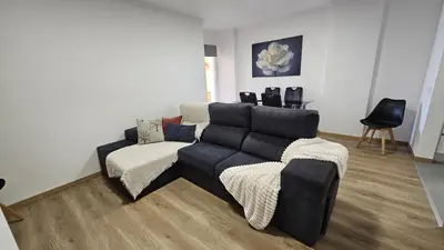a living room with a couch and a chair at October Nest in Funchal