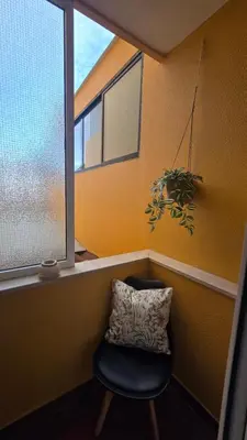 a bathroom with a toilet and a sink and a mirror at October Nest in Funchal