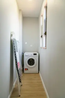 a laundry room with a washing machine in it at Michaels View - Calheta in Estreito da Calheta