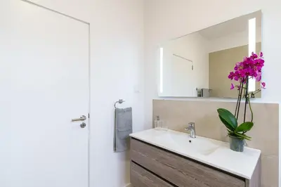 a bathroom with a sink and a mirror at Michaels View - Calheta in Estreito da Calheta
