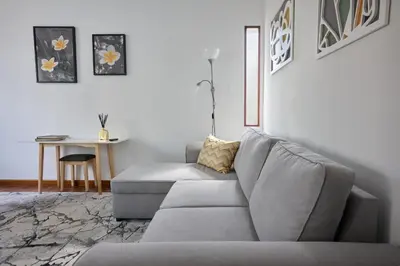 a living room with a couch and a table at Jasmine Whisper by Elysian in Funchal