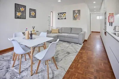 a living room with a white table and chairs at Jasmine Whisper by Elysian in Funchal