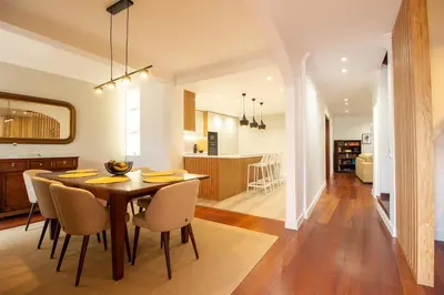 a kitchen and dining room with a table and chairs at Funchal Terrace House in Funchal