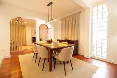 a dining room with a table and chairs at Funchal Terrace House in Funchal