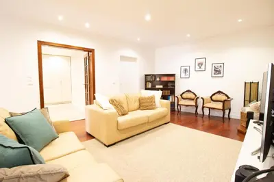 a living room with a couch and two chairs at Funchal Terrace House in Funchal