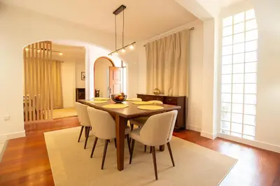 a dining room with a table and chairs at Funchal Terrace House in Funchal