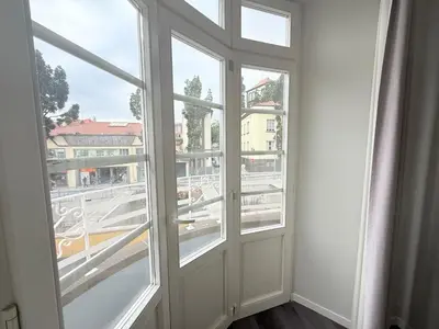 a room with two windows and a view of a city at Gold Center Funchal 104 in Funchal