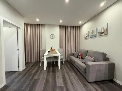 a living room with a couch and a table at Gold Center Funchal 104 in Funchal
