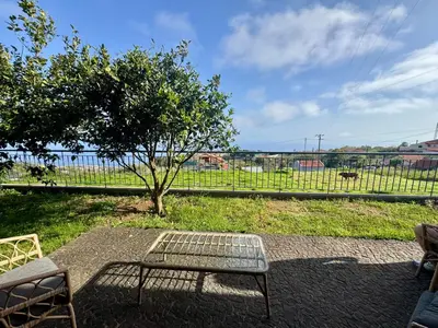 a bench and a table in front of a fence at Bella Vista Studio in Canhas