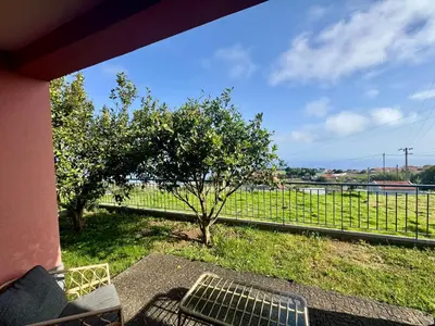 a porch with a bench and a tree and a fence at Bella Vista Studio in Canhas