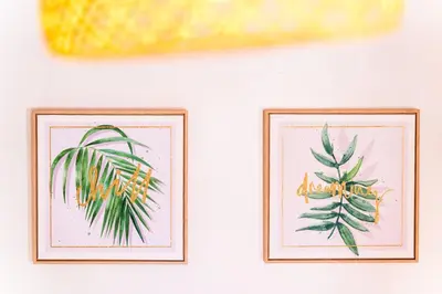 two framed pictures of plants on a wall at GuestReady - Madeiran peaceful nook in Porto Moniz