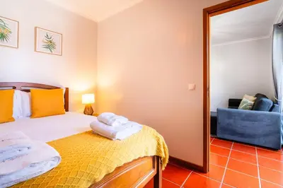 a bedroom with a bed and a mirror at GuestReady - Madeiran peaceful nook in Porto Moniz