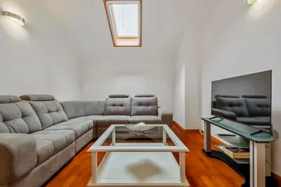 a living room with a couch and a coffee table at Modern Suburban Haven in Caniço