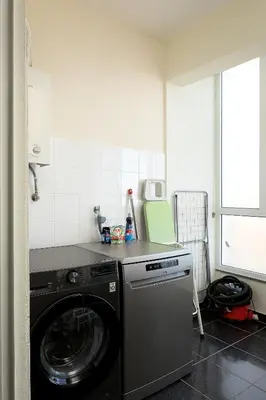 a kitchen with a washing machine in a room at Calheta, Sun, Sea & Pool in Calheta