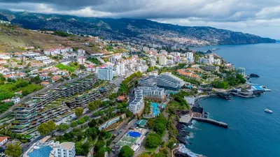an aerial view of a city next to the water at Savoy Luxury Residence Apartment in Funchal
