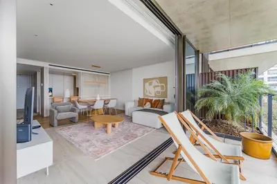 a living room with a couch and a tv at Savoy Luxury Residence Apartment in Funchal