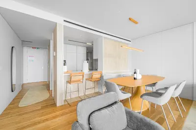 a living room with a table and chairs at Savoy Luxury Residence Apartment in Funchal