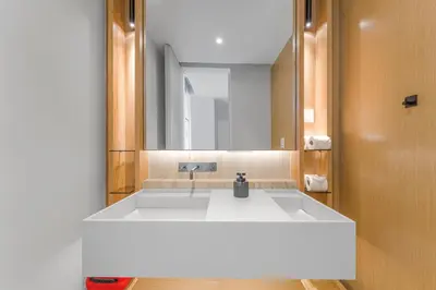 a bathroom with a sink and a mirror at Savoy Luxury Residence Apartment in Funchal