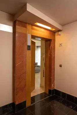 a hallway with a door leading into a room at JOY Forum I in Funchal