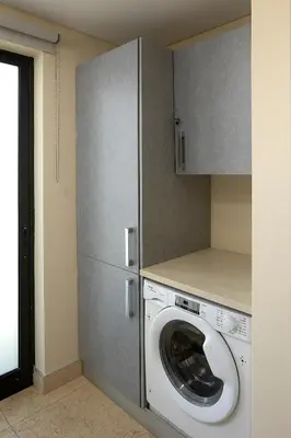a laundry room with a washing machine in a kitchen at JOY Forum I in Funchal