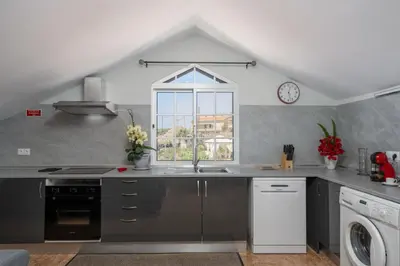 a kitchen with a sink and a window at OurMadeira - Ponta do Sol SeaView in Relógio do Poiso