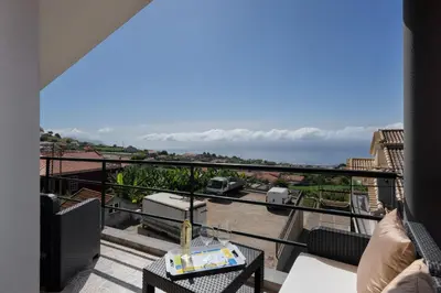a balcony with a view of the ocean at OurMadeira - Ponta do Sol SeaView in Relógio do Poiso