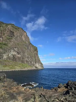 a view of the ocean from a rocky shore at Casa da Cruz in Porto da Cruz