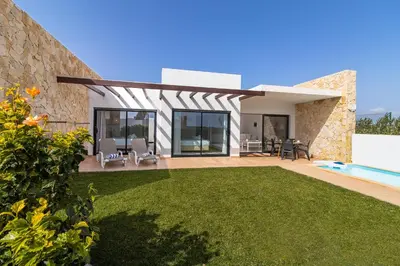a house with a yard with a swimming pool at Villa Infante in Sagres