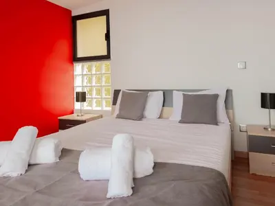 a staircase in a house with a large window at Skyline Villas Top in Arco da Calheta