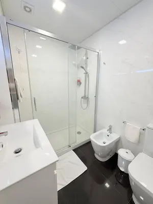 a bathroom with a shower and a sink and a toilet at Gold Center Funchal 102 in Funchal
