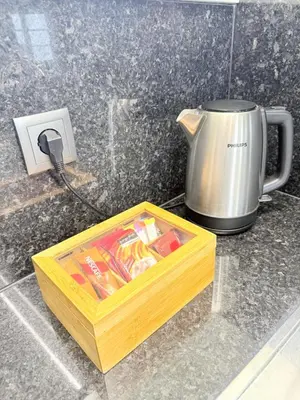 a wooden box sitting on a counter next to a coffee pot at Gold Center Funchal 105 in Funchal