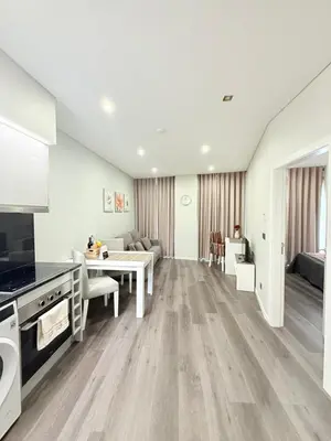 a living room with a kitchen and a dining room at Gold Center Funchal 105 in Funchal
