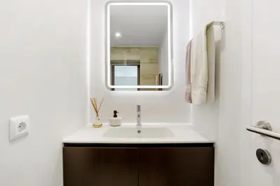a bathroom with a sink and a mirror at Tini´s House Madeira Holiday in Gaula